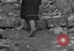 Image of Italian citizens in ruined village Italy, 1944, second 60 stock footage video 65675056390