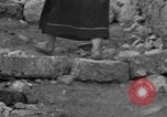 Image of Italian citizens in ruined village Italy, 1944, second 61 stock footage video 65675056390