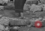Image of Italian citizens in ruined village Italy, 1944, second 62 stock footage video 65675056390