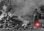 Image of German children burn Nazi materials Cologne Germany, 1945, second 42 stock footage video 65675056409
