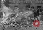 Image of German children burn Nazi materials Cologne Germany, 1945, second 52 stock footage video 65675056409