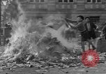 Image of German children burn Nazi materials Cologne Germany, 1945, second 53 stock footage video 65675056409