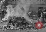 Image of German children burn Nazi materials Cologne Germany, 1945, second 56 stock footage video 65675056409