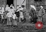 Image of Russian children receiving milk from local Soviet Russia, 1918, second 1 stock footage video 65675056584