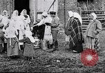 Image of Russian children receiving milk from local Soviet Russia, 1918, second 3 stock footage video 65675056584