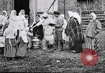 Image of Russian children receiving milk from local Soviet Russia, 1918, second 4 stock footage video 65675056584