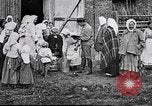 Image of Russian children receiving milk from local Soviet Russia, 1918, second 8 stock footage video 65675056584