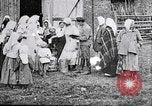 Image of Russian children receiving milk from local Soviet Russia, 1918, second 9 stock footage video 65675056584