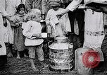 Image of Russian children receiving milk from local Soviet Russia, 1918, second 10 stock footage video 65675056584