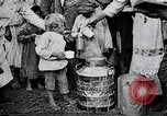 Image of Russian children receiving milk from local Soviet Russia, 1918, second 11 stock footage video 65675056584