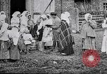 Image of Russian children receiving milk from local Soviet Russia, 1918, second 13 stock footage video 65675056584