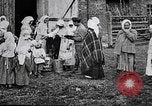 Image of Russian children receiving milk from local Soviet Russia, 1918, second 14 stock footage video 65675056584
