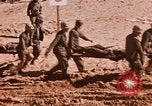 Image of Wounded marines carried to Higgins boats Iwo Jima, 1945, second 1 stock footage video 65675056725