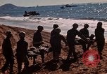 Image of Wounded marines carried to Higgins boats Iwo Jima, 1945, second 4 stock footage video 65675056725