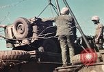 Image of Wounded marines carried to Higgins boats Iwo Jima, 1945, second 34 stock footage video 65675056725