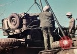 Image of Wounded marines carried to Higgins boats Iwo Jima, 1945, second 35 stock footage video 65675056725