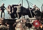 Image of Wounded marines carried to Higgins boats Iwo Jima, 1945, second 42 stock footage video 65675056725
