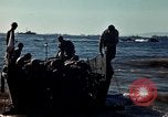 Image of Wounded marines carried to Higgins boats Iwo Jima, 1945, second 50 stock footage video 65675056725