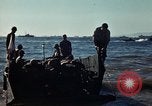 Image of Wounded marines carried to Higgins boats Iwo Jima, 1945, second 53 stock footage video 65675056725