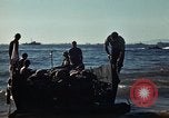 Image of Wounded marines carried to Higgins boats Iwo Jima, 1945, second 55 stock footage video 65675056725