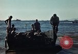 Image of Wounded marines carried to Higgins boats Iwo Jima, 1945, second 56 stock footage video 65675056725