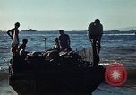 Image of Wounded marines carried to Higgins boats Iwo Jima, 1945, second 57 stock footage video 65675056725