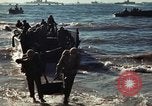 Image of Wounded marines carried to Higgins boats Iwo Jima, 1945, second 62 stock footage video 65675056725