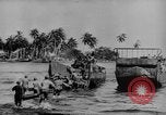 Image of US Soldiers labor and haul equipment Pacific Theater, 1944, second 8 stock footage video 65675056745