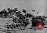 Image of US Soldiers labor and haul equipment Pacific Theater, 1944, second 10 stock footage video 65675056745