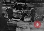 Image of US Soldiers labor and haul equipment Pacific Theater, 1944, second 11 stock footage video 65675056745