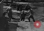 Image of US Soldiers labor and haul equipment Pacific Theater, 1944, second 12 stock footage video 65675056745