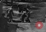 Image of US Soldiers labor and haul equipment Pacific Theater, 1944, second 13 stock footage video 65675056745