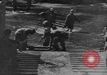 Image of US Soldiers labor and haul equipment Pacific Theater, 1944, second 15 stock footage video 65675056745