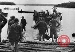 Image of US Soldiers labor and haul equipment Pacific Theater, 1944, second 20 stock footage video 65675056745