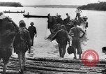 Image of US Soldiers labor and haul equipment Pacific Theater, 1944, second 21 stock footage video 65675056745