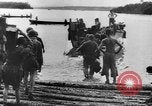 Image of US Soldiers labor and haul equipment Pacific Theater, 1944, second 22 stock footage video 65675056745