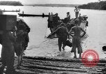 Image of US Soldiers labor and haul equipment Pacific Theater, 1944, second 23 stock footage video 65675056745