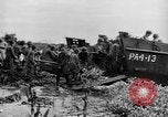 Image of US Soldiers labor and haul equipment Pacific Theater, 1944, second 27 stock footage video 65675056745