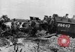 Image of US Soldiers labor and haul equipment Pacific Theater, 1944, second 29 stock footage video 65675056745
