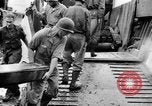Image of US Soldiers labor and haul equipment Pacific Theater, 1944, second 30 stock footage video 65675056745
