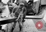 Image of US Soldiers labor and haul equipment Pacific Theater, 1944, second 31 stock footage video 65675056745