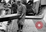 Image of US Soldiers labor and haul equipment Pacific Theater, 1944, second 32 stock footage video 65675056745