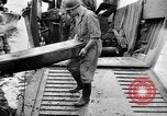 Image of US Soldiers labor and haul equipment Pacific Theater, 1944, second 33 stock footage video 65675056745