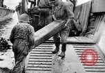 Image of US Soldiers labor and haul equipment Pacific Theater, 1944, second 35 stock footage video 65675056745