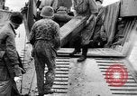 Image of US Soldiers labor and haul equipment Pacific Theater, 1944, second 37 stock footage video 65675056745