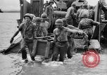 Image of US Soldiers labor and haul equipment Pacific Theater, 1944, second 46 stock footage video 65675056745