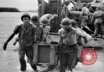 Image of US Soldiers labor and haul equipment Pacific Theater, 1944, second 49 stock footage video 65675056745