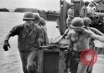 Image of US Soldiers labor and haul equipment Pacific Theater, 1944, second 51 stock footage video 65675056745