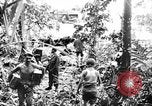 Image of US Soldiers labor and haul equipment Pacific Theater, 1944, second 61 stock footage video 65675056745