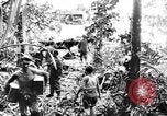 Image of US Soldiers labor and haul equipment Pacific Theater, 1944, second 62 stock footage video 65675056745